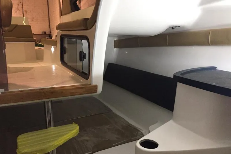 Slide: The Image of Interior of 2026 Hanover 305 boat, featuring seating and storage compartments. - 8