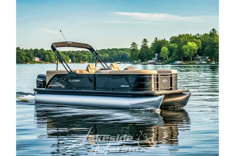 The Image of 2026 Godfrey Sweetwater 2286 SBC pontoon boat cruising on a serene lake. - 0