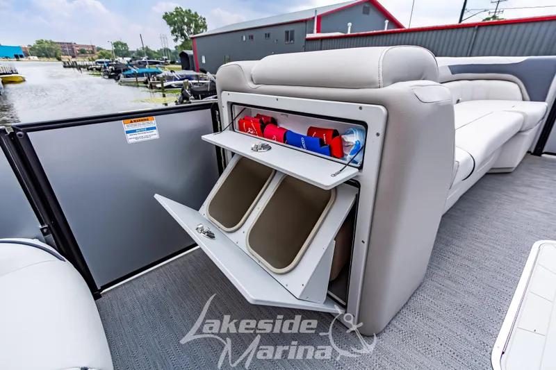 Slide: The Image of 2026 Godfrey Sweetwater 2286 SBC boat interior with open storage compartments. - 10