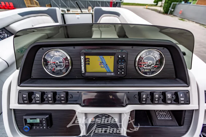 Slide: The Image of Dashboard of 2026 Godfrey Sweetwater 2286 SBC with navigation system and controls. - 14