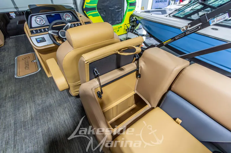 Slide: The Image of Interior of 2026 Godfrey Sweetwater 2286 SBC boat with tan seating and modern dashboard. - 26