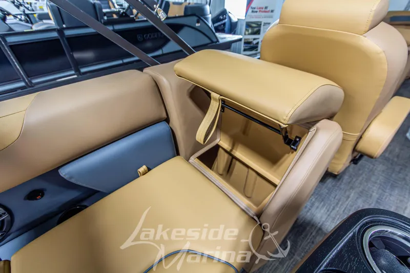 Slide: The Image of 2026 Godfrey Sweetwater 2286 SBC boat interior with tan leather seating and storage compartment. - 27