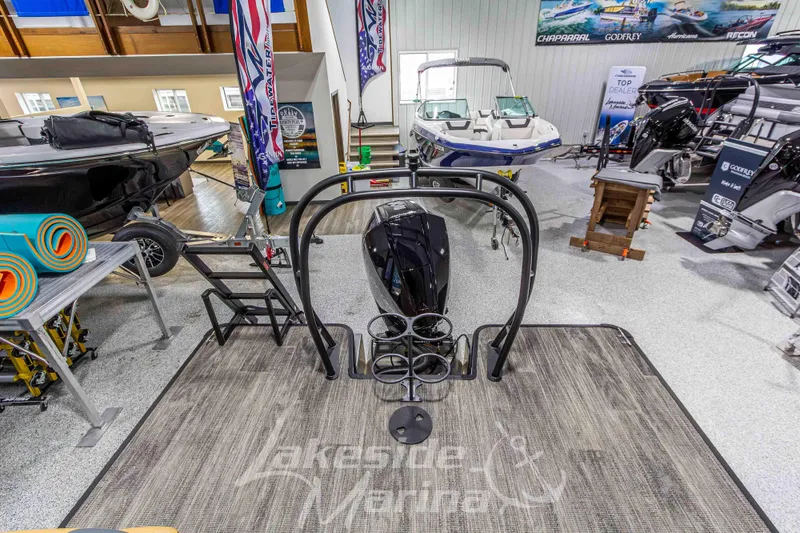 Slide: The Image of 2026 Godfrey Sweetwater 2286 SBC boat displayed in a marina showroom. - 29