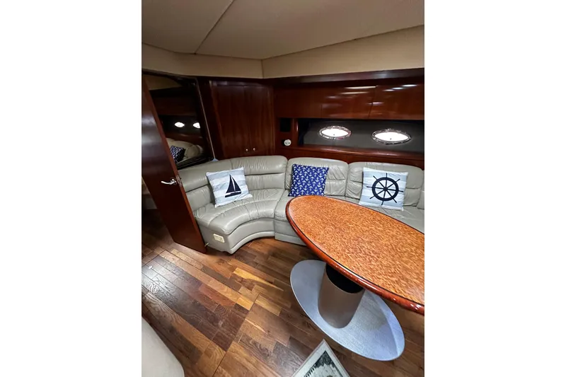 Slide: The Image of 2005 Cruisers Yachts 500 Express docked, featuring spacious seating and sleek design. - 12