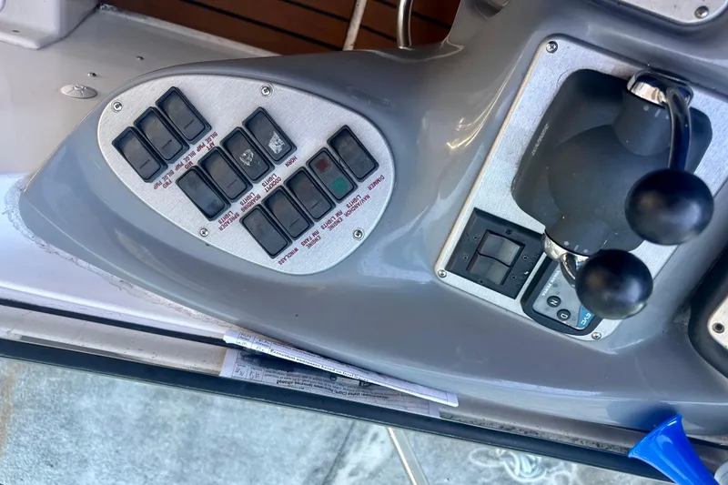 Slide: The Image of Control panel of a 2005 Cruisers Yachts 500 Express boat cockpit. - 18