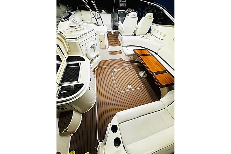 Slide: The Image of 2005 Cruisers Yachts 500 Express interior with elegant seating and wooden flooring. - 25