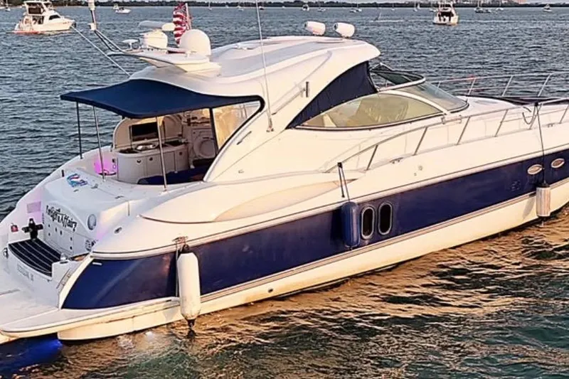 Slide: The Image of 2005 Cruisers Yachts 500 Express in water, featuring sleek design and blue accents. - 4