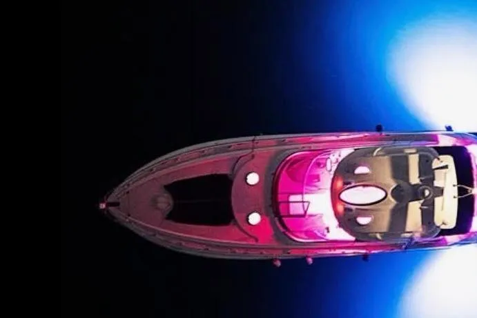Slide: The Image of Aerial view of 2005 Cruisers Yachts 500 Express with vibrant lighting. - 9