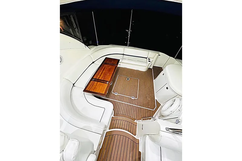 Slide: The Image of 2005 Cruisers Yachts 500 Express docked in a sunny marina setting. - 11