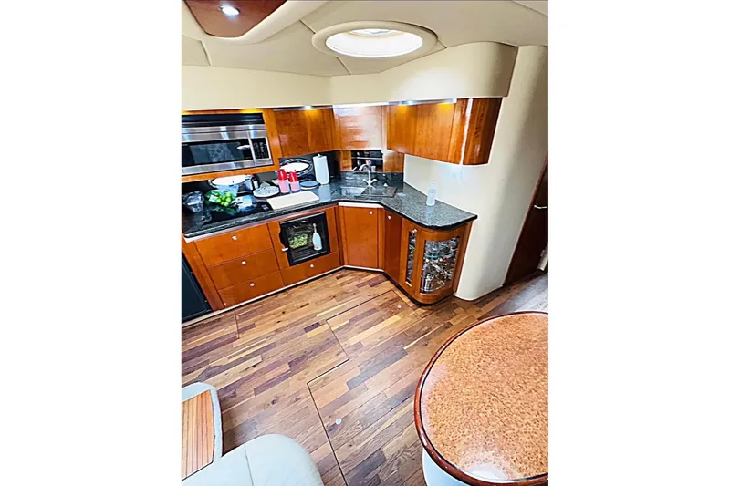 Slide: The Image of 2005 Cruisers Yachts 500 Express deck with solar panels and blue mat. - 13