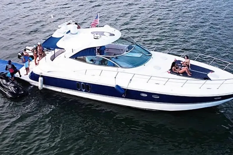 Slide: The Image of 2005 Cruisers Yachts 500 Express on water with people enjoying leisure activities. - 3