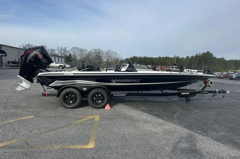 The Image of 2026 Phoenix 921 Elite X boat on trailer in parking lot. - 0