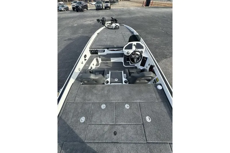 Slide: The Image of 2026 Phoenix 921 Elite X boat interior with steering console and seating. - 5