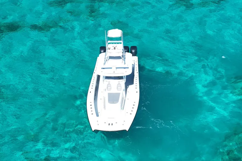 Slide: The Image of Aerial view of 2024 Freeman 42 boat on clear turquoise water. - 11