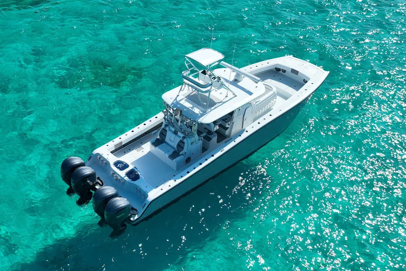 Slide: The Image of 2024 Freeman 42 boat on clear turquoise water, aerial view. - 17