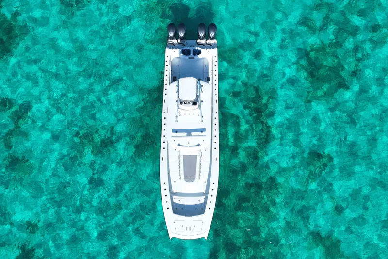 Slide: The Image of Aerial view of 2024 Freeman 42 yacht on clear turquoise water. - 21