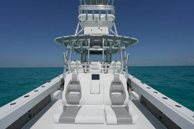 Slide: The Image of 2024 Freeman 42 boat on open sea, featuring sleek seating and modern design. - 26