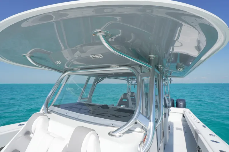 Slide: The Image of 2024 Freeman 42 boat on turquoise water, showcasing sleek design and modern features. - 39