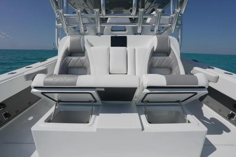 Slide: The Image of Luxurious seating on 2024 Freeman 42 boat with ocean backdrop. - 43
