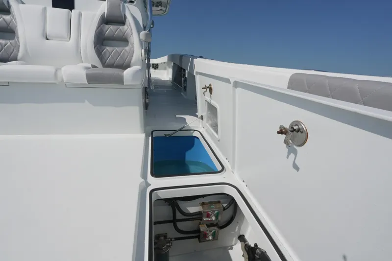 Slide: The Image of 2024 Freeman 42 boat interior with seating and storage compartments. - 44