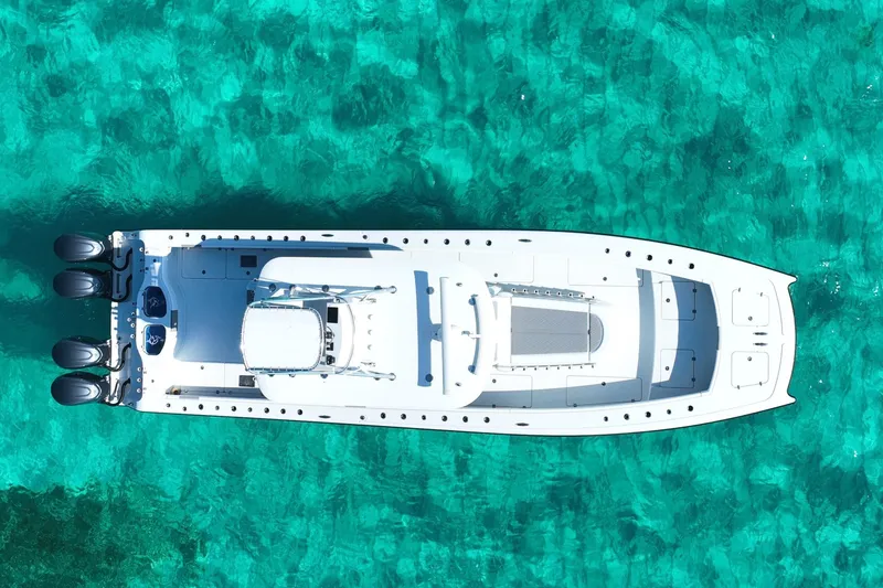 Slide: The Image of Aerial view of 2024 Freeman 42 boat on clear turquoise water. - 8