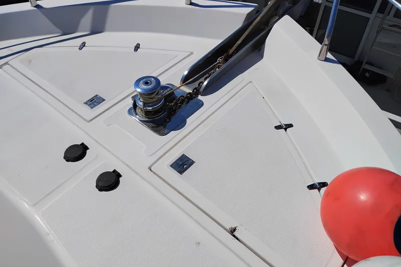 Slide: The Image of Deck of 1997 Symbol 50 Pilothouse with anchor winch and red buoy. - 10