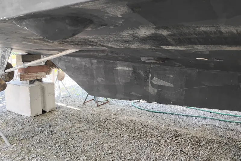 Slide: The Image of Underside of a 1997 Symbol 50 Pilothouse boat on dry dock. - 101