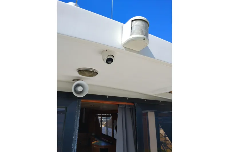 Slide: The Image of Security camera and speaker on 1997 Symbol 50 Pilothouse yacht exterior. - 15