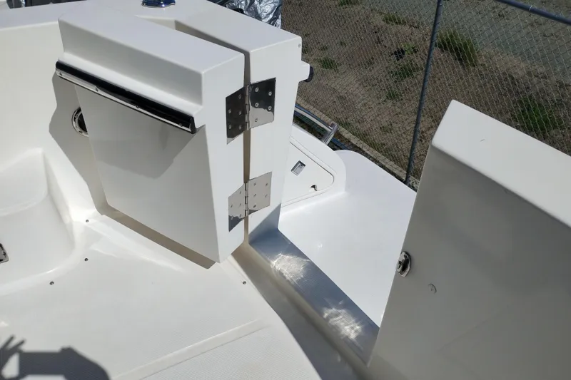 Slide: The Image of White deck area of a 1997 Symbol 50 Pilothouse boat with hinged compartments. - 2