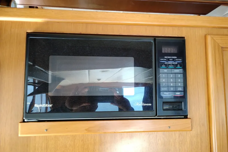 Slide: The Image of GoldStar microwave in a 1997 Symbol 50 Pilothouse yacht kitchen. - 25