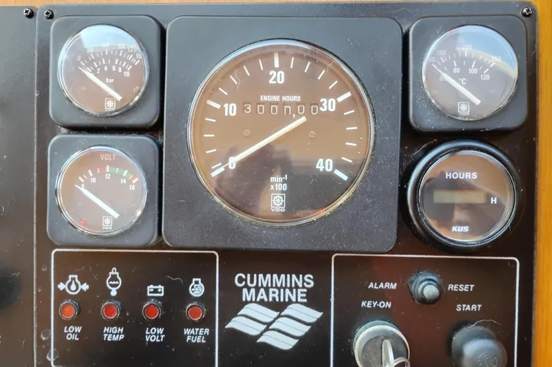 Slide: The Image of Control panel of a 1997 Symbol 50 Pilothouse with Cummins Marine gauges. - 36