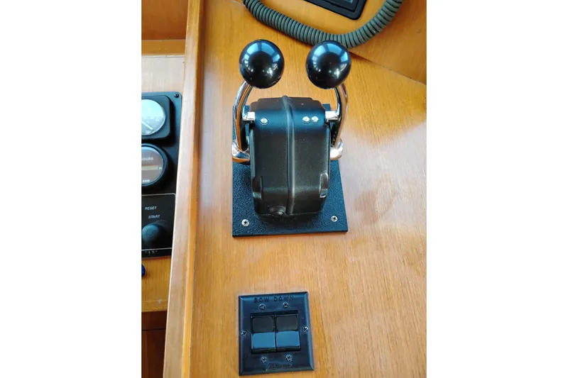 Slide: The Image of Throttle controls on a 1997 Symbol 50 Pilothouse yacht dashboard. - 39