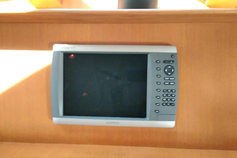 Slide: The Image of Garmin GPS device on 1997 Symbol 50 Pilothouse boat dashboard. - 42