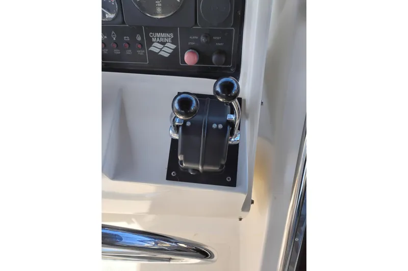 Slide: The Image of Control panel of a 1997 Symbol 50 Pilothouse boat with Cummins Marine throttle. - 54