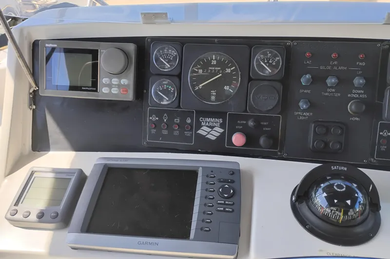 Slide: The Image of Control panel of a 1997 Symbol 50 Pilothouse with navigation and monitoring instruments. - 55