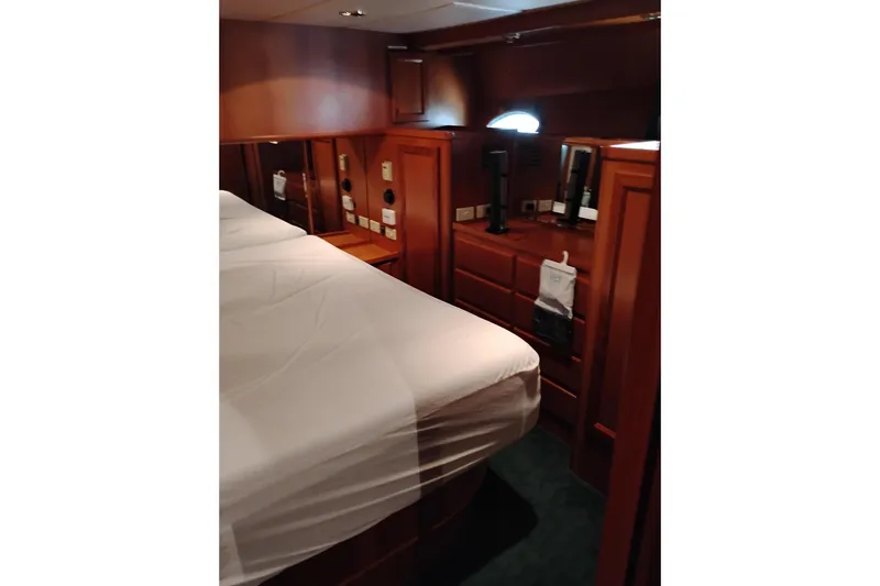 Slide: The Image of Luxurious cabin interior of a 1997 Symbol 50 Pilothouse yacht with wooden furnishings. - 63