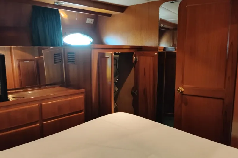 Slide: The Image of Cozy wooden interior of a 1997 Symbol 50 Pilothouse yacht cabin. - 64