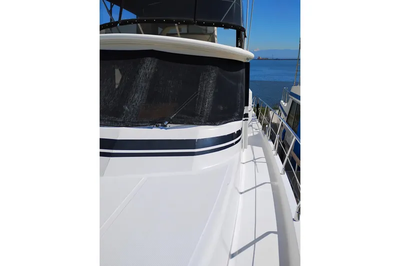 Slide: The Image of 1997 Symbol 50 Pilothouse yacht deck with ocean view. - 7