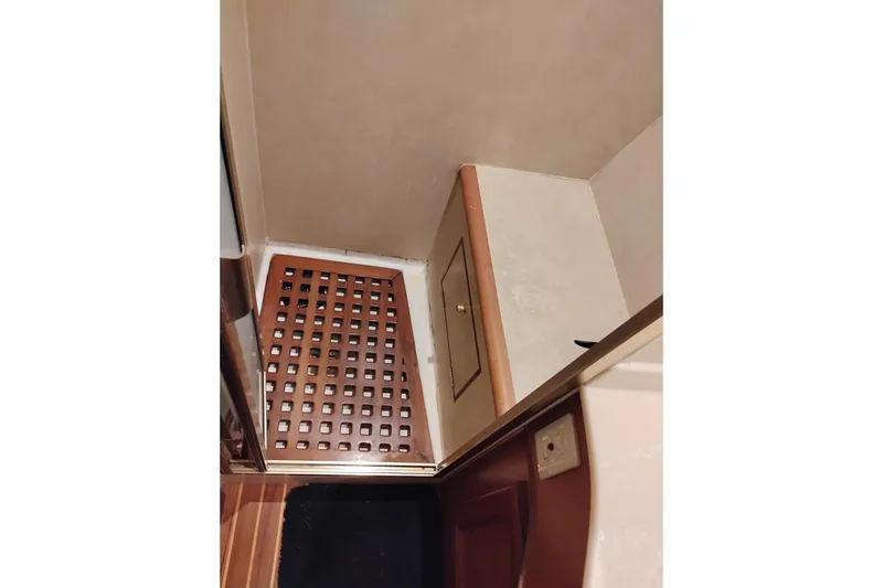 Slide: The Image of Interior of 1997 Symbol 50 Pilothouse with wooden floor and storage compartment. - 70