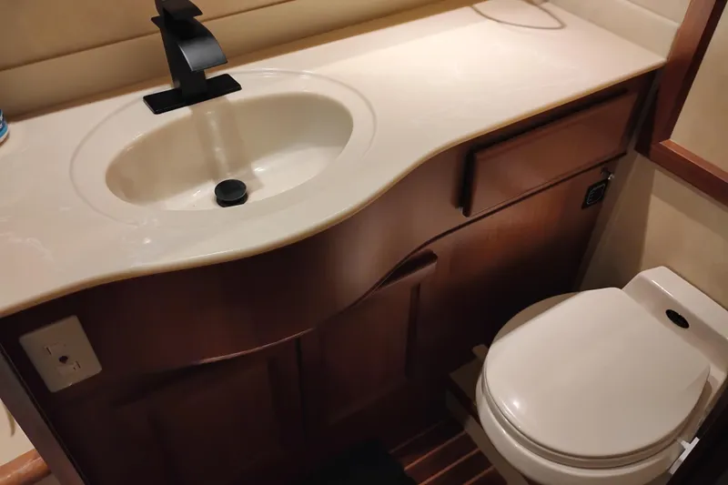 Slide: The Image of Bathroom interior of a 1997 Symbol 50 Pilothouse yacht with sink and toilet. - 71