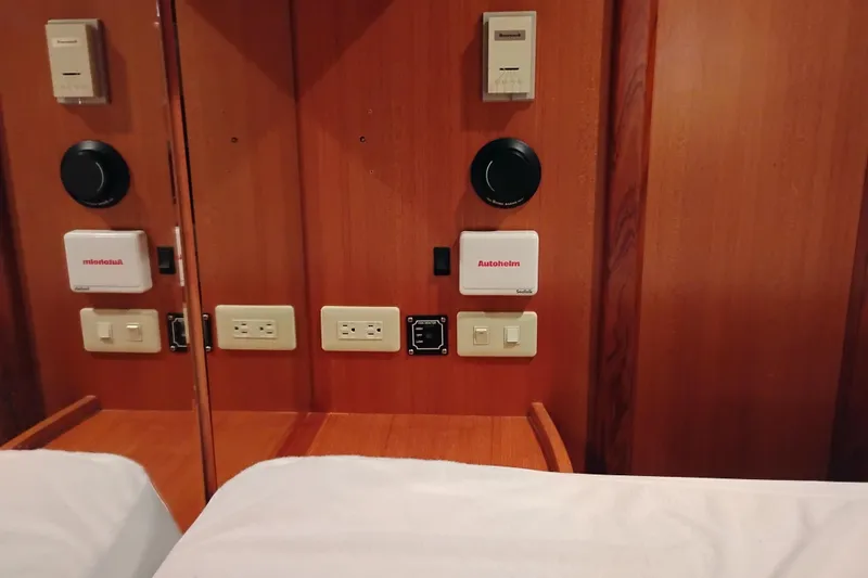Slide: The Image of Control panel with outlets and switches on a 1997 Symbol 50 Pilothouse yacht interior. - 72