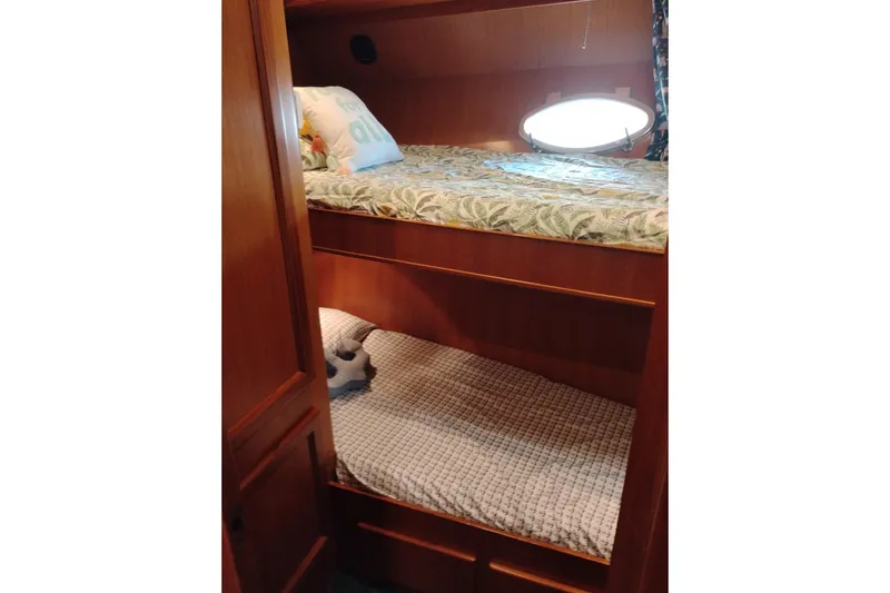 Slide: The Image of Bunk beds in 1997 Symbol 50 Pilothouse yacht cabin with wooden interior. - 74