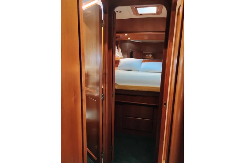 Slide: The Image of Cozy cabin interior of a 1997 Symbol 50 Pilothouse yacht with wooden finish. - 80