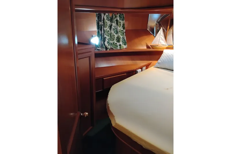 Slide: The Image of Cozy cabin interior of 1997 Symbol 50 Pilothouse with wooden furnishings and nautical decor. - 82