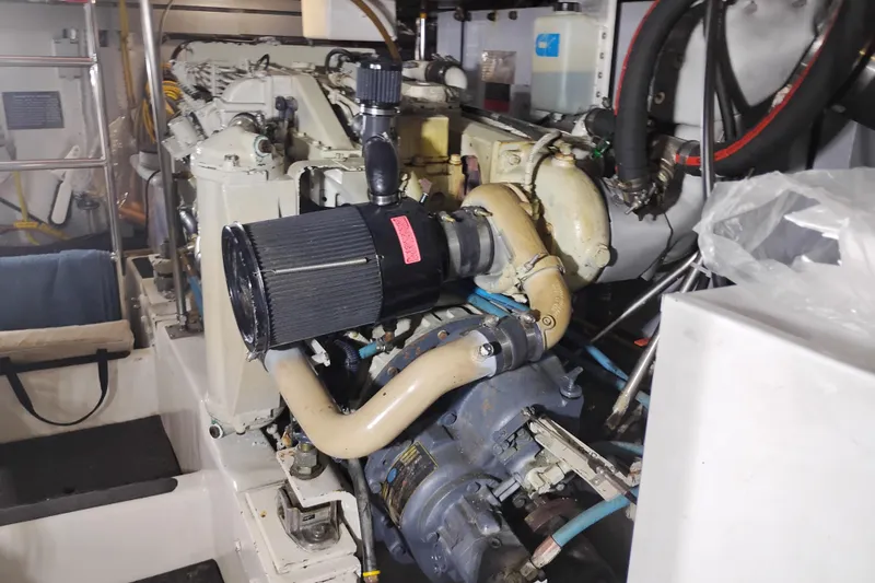 Slide: The Image of Engine room of a 1997 Symbol 50 Pilothouse yacht, showcasing mechanical components. - 91