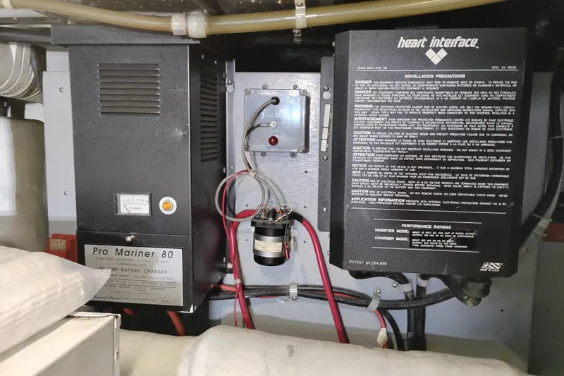 Slide: The Image of Electrical equipment in a 1997 Symbol 50 Pilothouse, featuring Pro Mariner 80 battery charger. - 94
