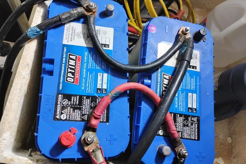 Slide: The Image of Blue Optima marine batteries with cables, Symbol 50 Pilothouse 1997 model. - 97