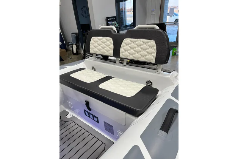 Slide: The Image of 2026 Highfield Sport 330 boat interior with quilted seating and modern design. - 6