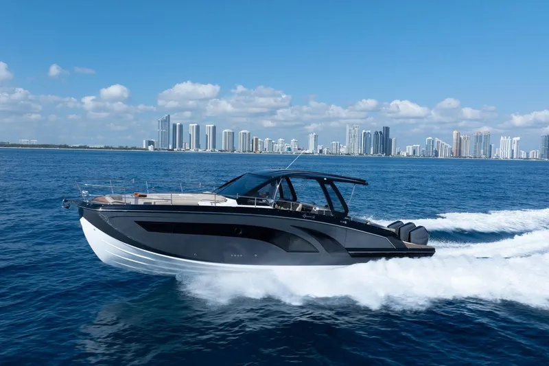 Slide: The Image of Luxury Hanover 447 yacht cruising near city skyline, 2026 model. - 10