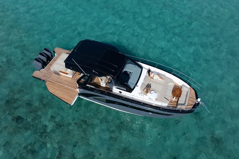 Slide: The Image of Aerial view of 2026 Hanover 447 luxury yacht on clear turquoise water. - 13